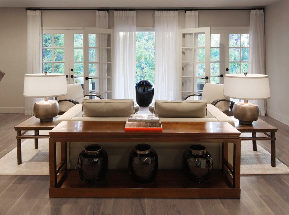We created a wood riser for this antique bench and placed antique Chinese jars underneath.